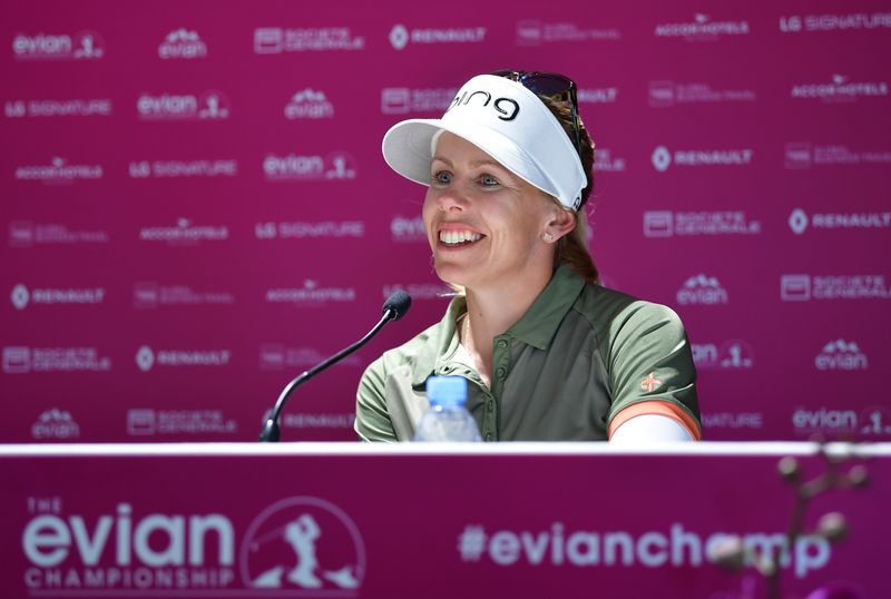 Pernilla Lindberg smiling at a microphone in front of an Evian Championship backdrop