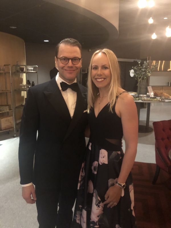 Pernilla Lindberg in an evening gown standing beside Prince Daniel of Sweden in a tuxedo